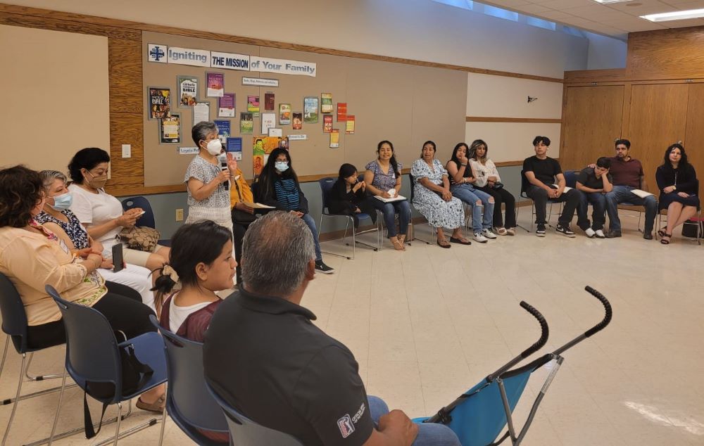 Sr. Martha de la Torre Juárez, co-director for leadership development of Strangers No Longer, leads a women's support circle in Ann Arbor, Michigan, in summer 2022.