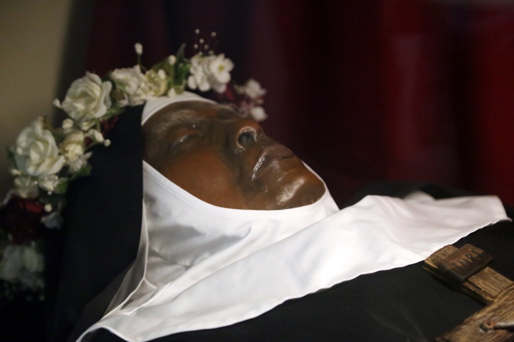The remarkably intact body of Sister Wilhelmina Lancaster, Abbey of Our Lady of Ephesus, Gower, Missouri, May 26, 2024. Close up of the exhumed nun's face, wearing habit and crown of roses.