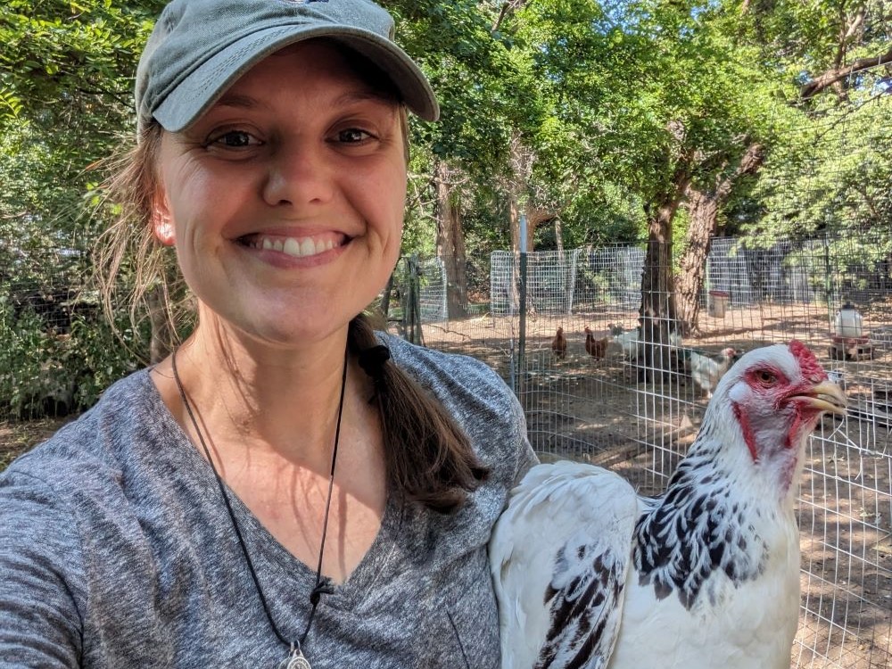 Sr. Terri Schell poses with a chicken. Sr. Terri Schell poses with a chicken.