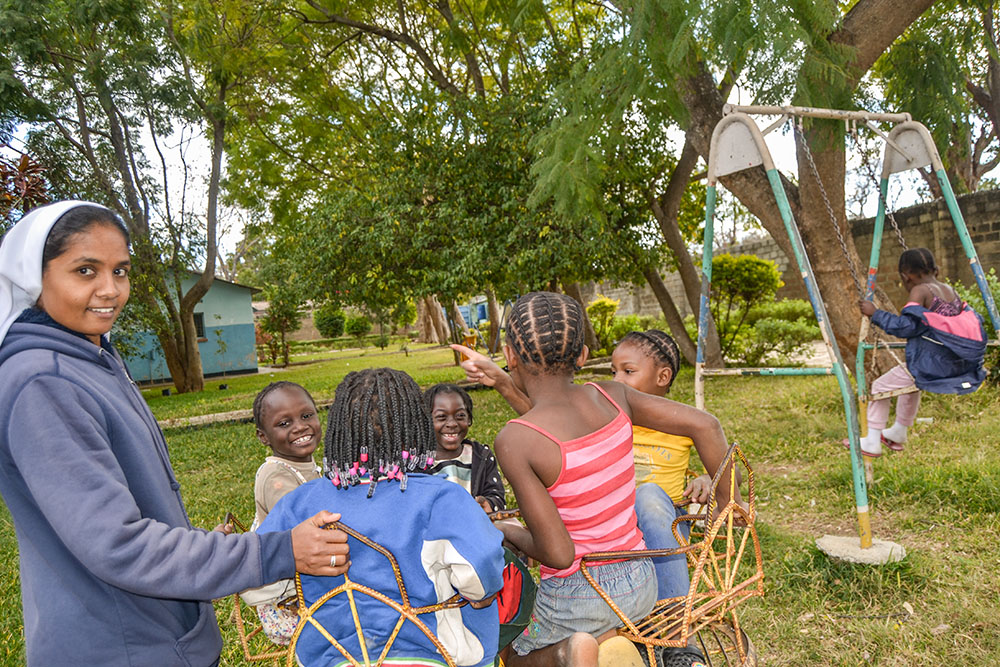 Immaculate Conception Sr. Theresa Kulandai engages the younger girls in conversation at Home of Joy in Lusaka, Zambia. (Derrick Silimina)