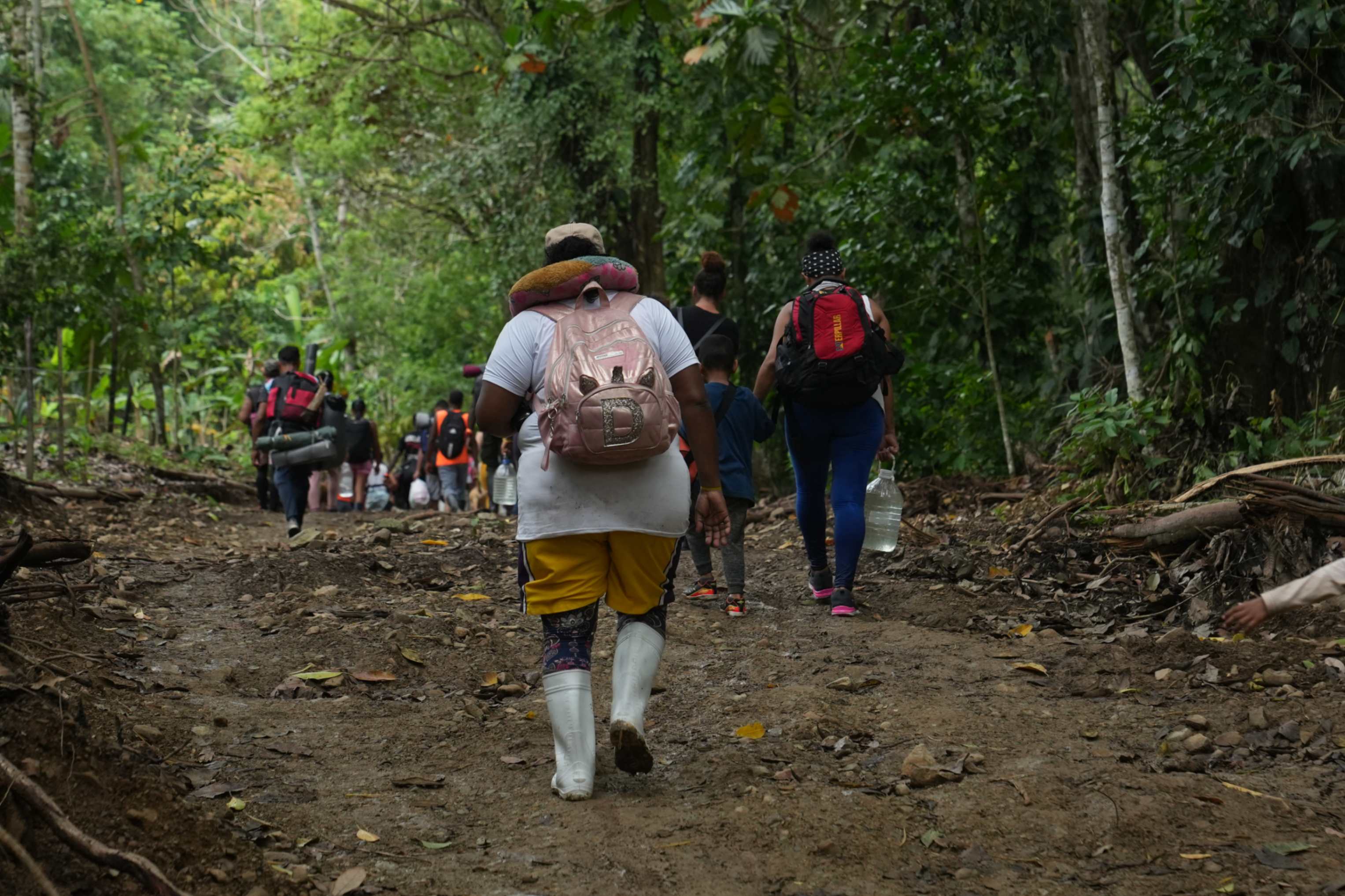 Migrants form small groups to protect themselves as they journey through the wild roads of the Darién Gap, with some acting as lookouts while others protect the most vulnerable people. Migrants form small groups to protect themselves as they journey through the wild roads of the Darién Gap, with some acting as lookouts while others protect the most vulnerable people.
