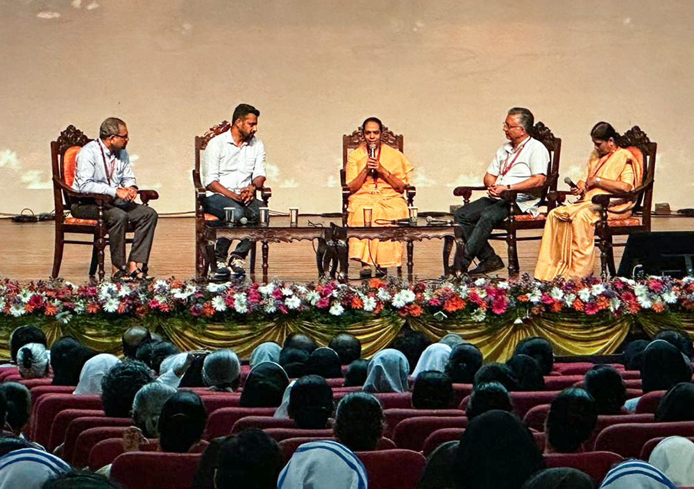 Apostolic Carmel Sr. Maria Nirmalini, center, facilitates a panel discussion on emerging issues of the Church in India. Second from left is Livin Varghese, a young Catholic who shared his concerns in the national assembly of the Conference of Religious India. (Courtesy of Livin Varghese)