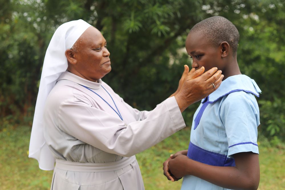 Sr. Bernadette Nthenya of the Sisters of Mary of Kakamega interacts with a girl she rescued from selling fish on the shores of Lake Victoria. Sr. Bernadette Nthenya of the Sisters of Mary of Kakamega interacts with a girl she rescued from selling fish on the shores of Lake Victoria.