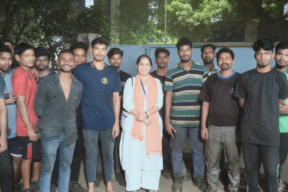 Sr. Sujata Jena taking a group photo with migrant workers Sr. Sujata Jena with the young migrant workers at Emerging from Equipment (Pvt, Ltd) company, Chennai on January 22, 2025