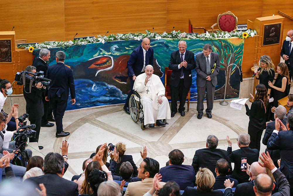 Pope Francis waves goodbye at the conclusion of a meeting of Scholas Occurentes in Rome May 19, 2022. The event was for the launch of the "Laudato Si' School," a yearlong project of Scholas young people to develop projects to promote protection of the environment. (CNS/Paul Haring)