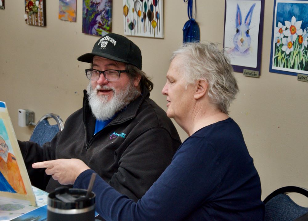 Daughters of Charity Sr. Brenda Fritz, right, consults with painting student Zack Davisson at Presentation Arts Center in St. Louis March 11.