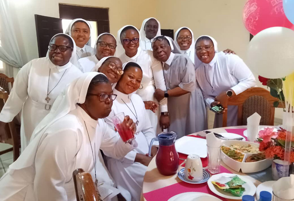 Sr. Anthonia Uche, fourth person from the right, celebrates the birthday of a community member Nov. 2, 2024, in Abuja, Nigeria. (Courtesy of Antonia Uche)