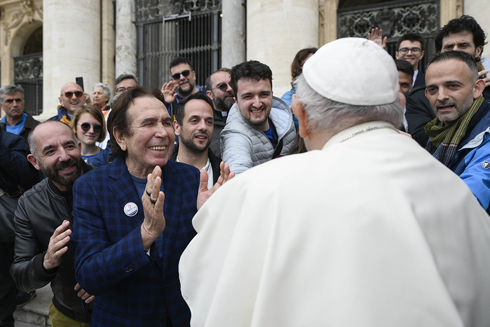 Pope Francis greets members of Mosaiko, a Rome organization for LGBT Christians, at the end of his weekly general audience in St. Peter's Square at the Vatican May 17, 2023. (CNS/Vatican Media)