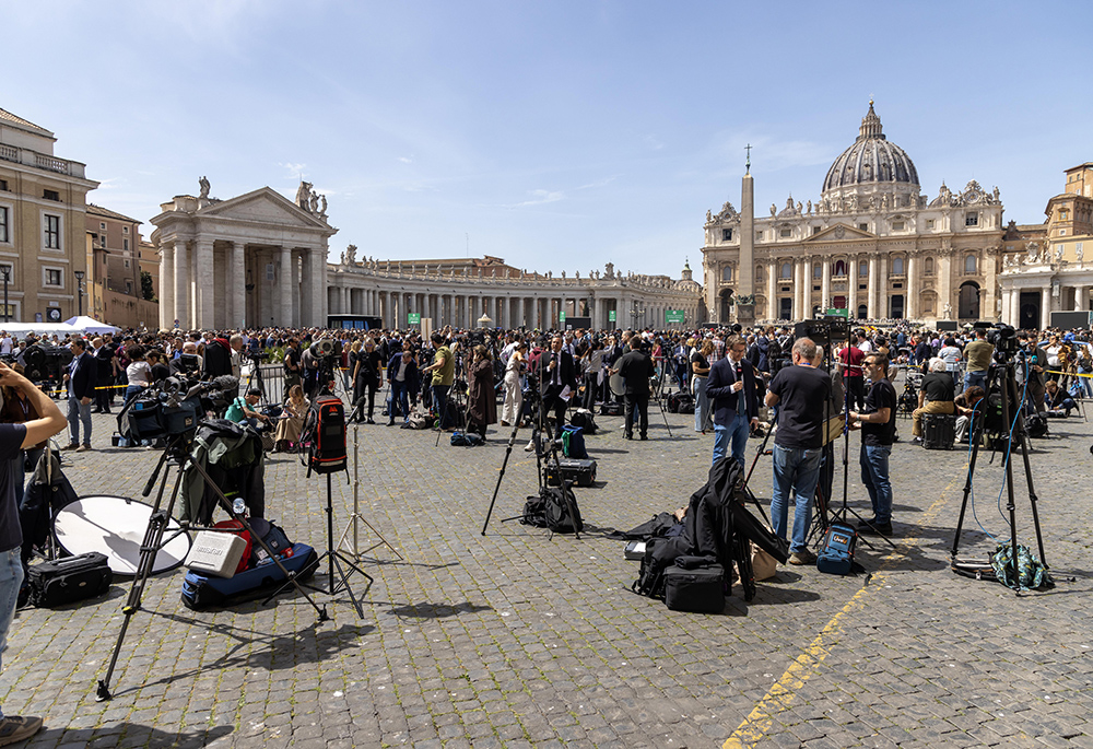 Dozens of reporters set up cameras outside St. Peter's Square at the Vatican April 21, 2025, as news of Pope Francis' death spread. The Argentine pope died at 7:35 a.m. that morning at the age of 88. (CNS/Pablo Esparza)