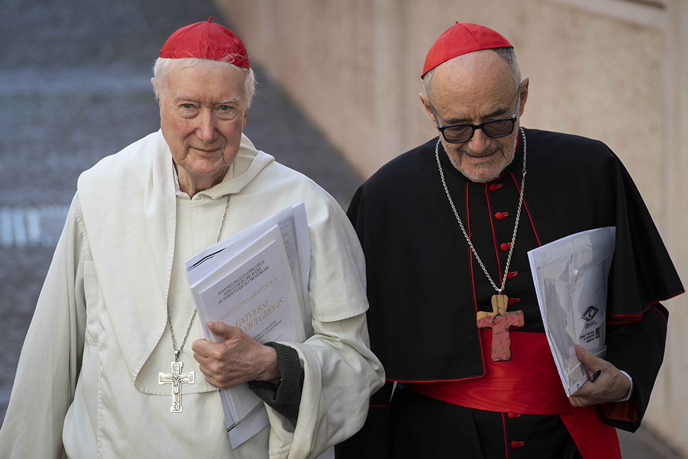 Cardinals Timothy Radcliffe and Michael Czerny walk through the Vatican on their way to the first general congregation of the College of Cardinals April 22, 2025, in the Vatican Synod Hall. (CNS/Vatican Media)