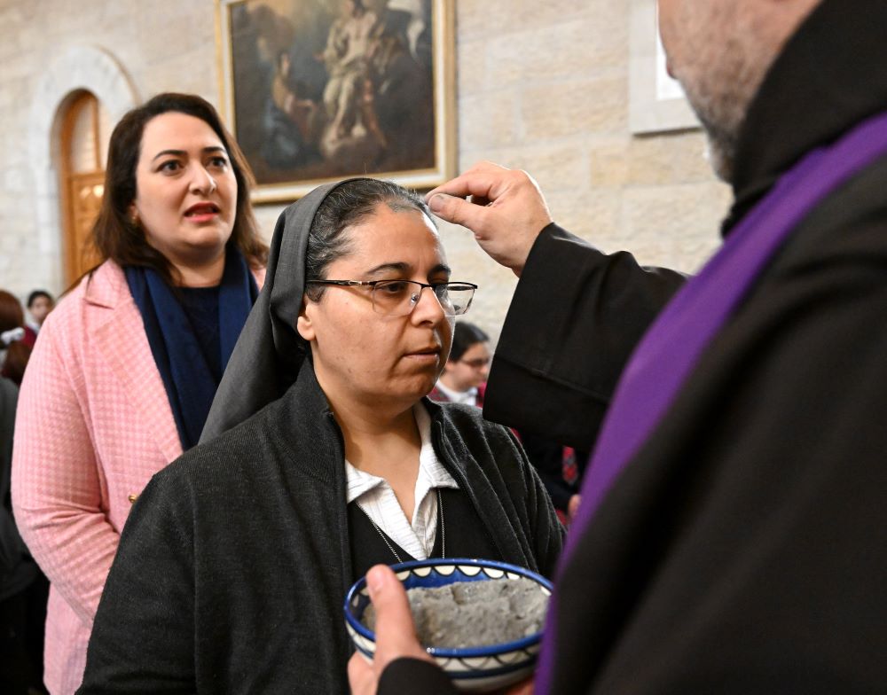 Priest gives ashes