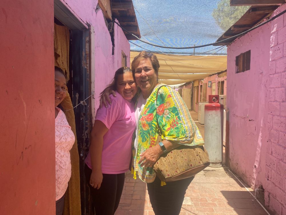 Sr. Suzanne Jabro receives a hug from a woman in Mexicali, Mexico. he Border Compassion ministry she founded. The organization is part of a coalition of women religious formed to help migrants on both sides of the border. (GSR photo/Rhina Guidos)
