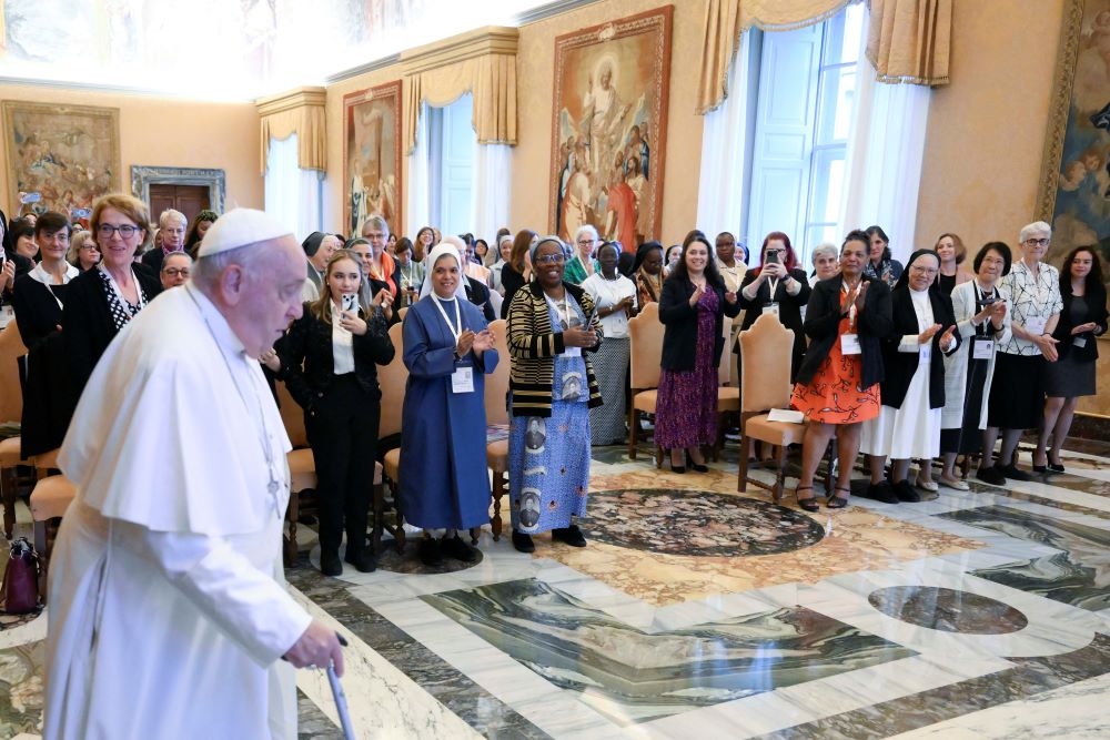 Pope Francis arrives for a meeting with women participating in or assisting the Synod of Bishop.