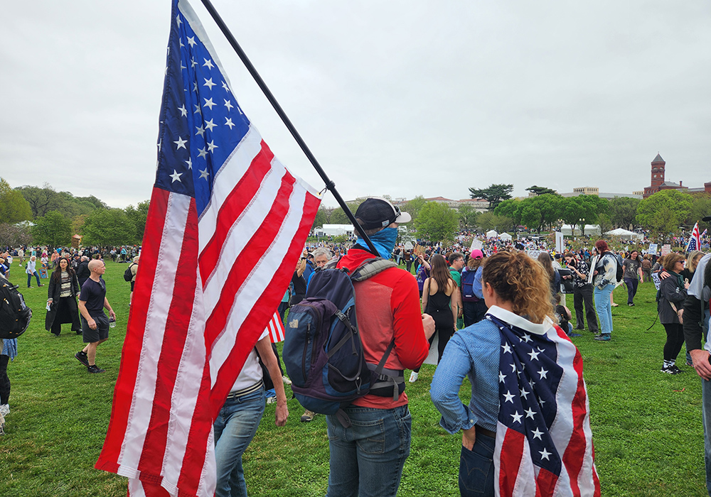 American flags — held aloft or draped around shoulders — were ubiquitous during the "Hands Off!" demonstration April 5 on the National Mall in Washington D.C. (GSR photo/Chris Herlinger)