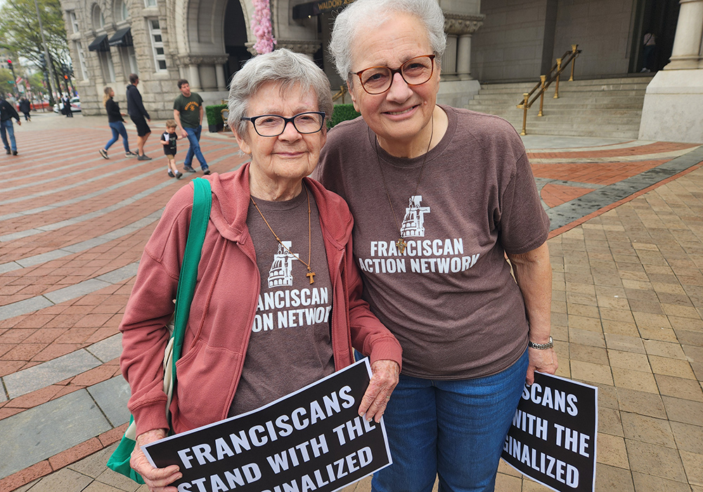 Sr. Maria Orlandini, right, and Sr. Marie Lucey, both Franciscans, represented the justice advocacy group Franciscan Action Network during April 5 "Hands Off!" demonstrations in Washington, D.C. (GSR photo/Chris Herlinger)