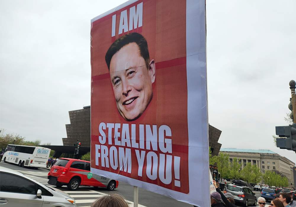 A sign satirizing Elon Musk during the April 5 "Hands Off!" demonstration in Washington, D.C. (GSR photo/Chris Herlinger)