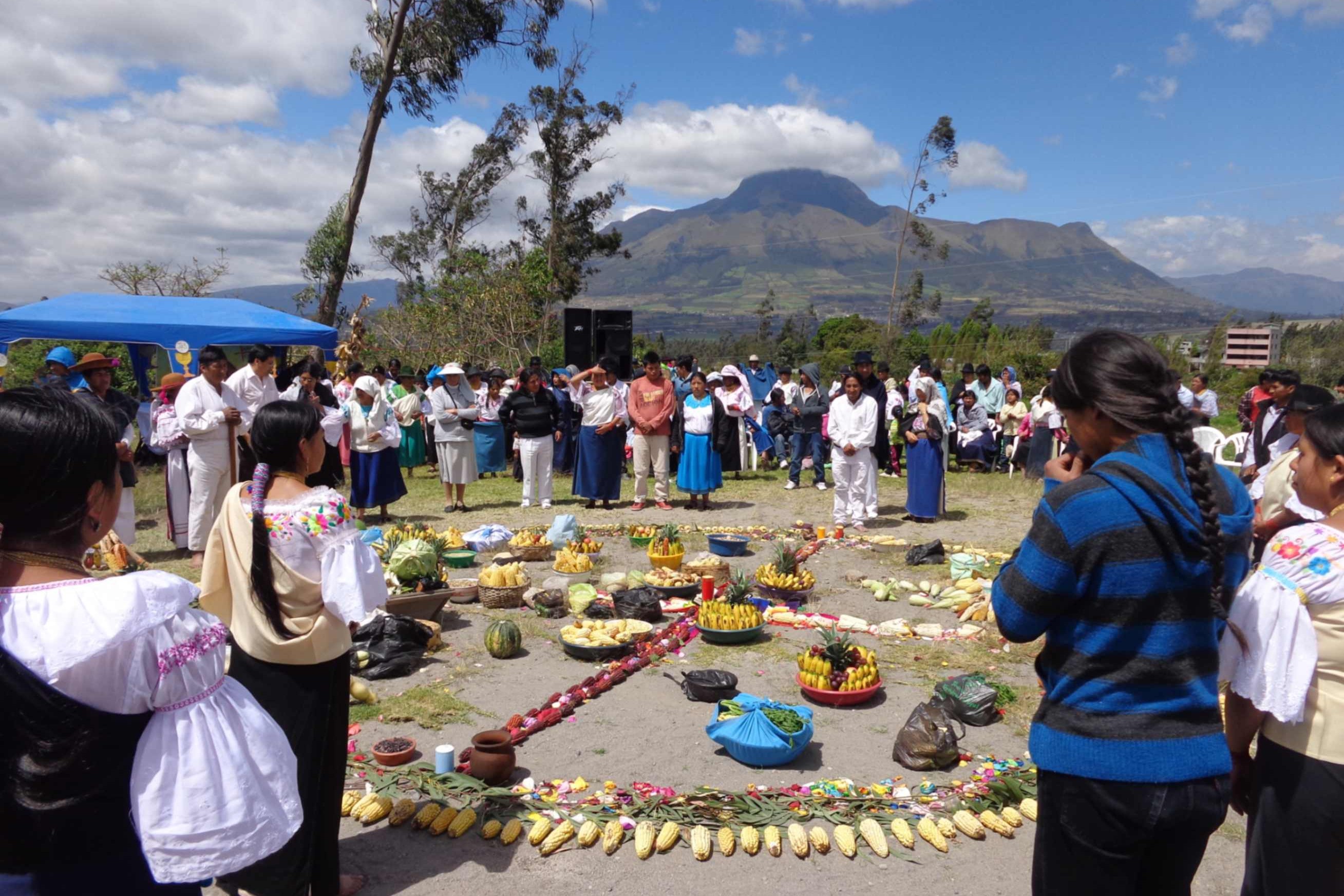 An inculturated celebration in a sacred pastoral place brings the community together around the four elements, symbolizing the union of peoples from different regions.