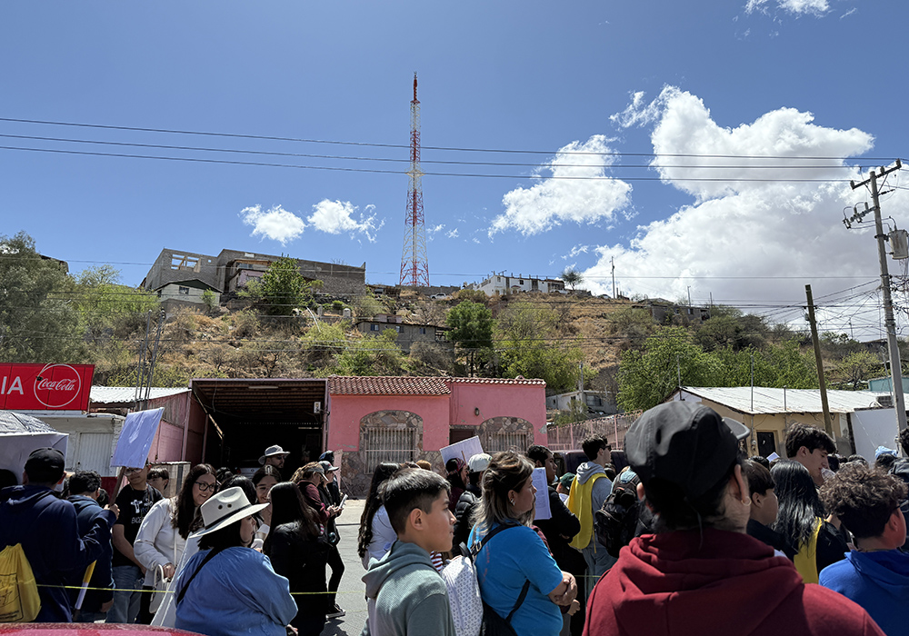 The hills of Nogales, Mexico, are seen to the south of a Via Crucis procession that flowed April 5 along the border in Nogales, Mexico. (Anita Snow)
