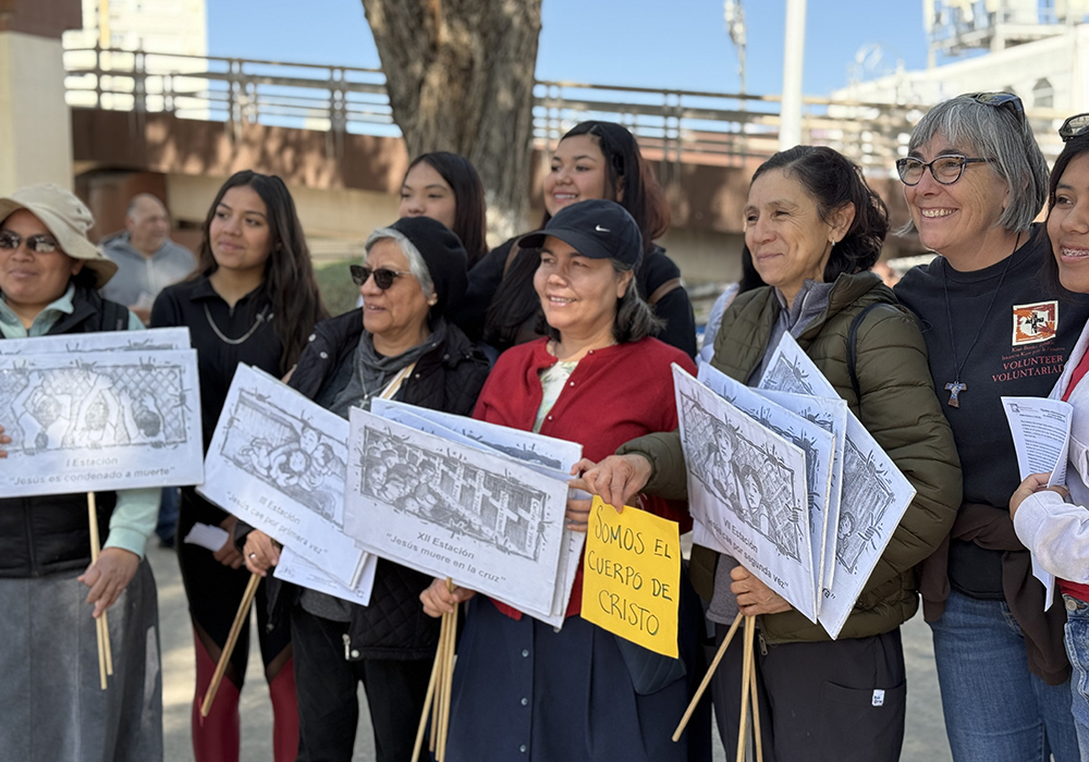 Participants in a symbolic Via Crucis held April 5 in Nogales, Mexico, pose for photos Saturday before the start of the procession honoring migrants. (Anita Snow)
