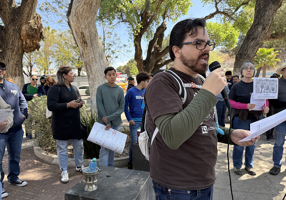 Pedro De Velasco, director of education and advocacy for the Kino Border Initiative in Nogales, Mexico, speaks to participants at a symbolic Via Crucis that the center organized April 5 along a length of the border in honor of migrants. (Anita Snow)