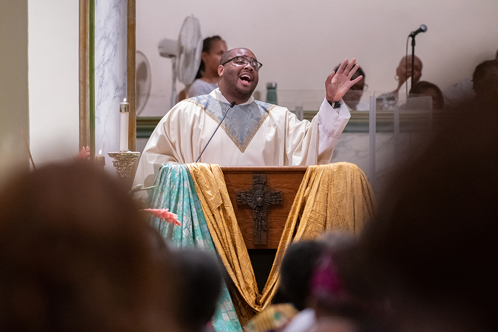 Fr. Kareem Smith of the Archdiocese of New York delivers the homily in Baltimore's historic St. Francis Xavier Church July 22, 2019, for a Mass honoring jubilarians during a joint conference of black priests, women religious, deacons and seminarians. (CNS/Catholic Review/Kevin J. Parks)