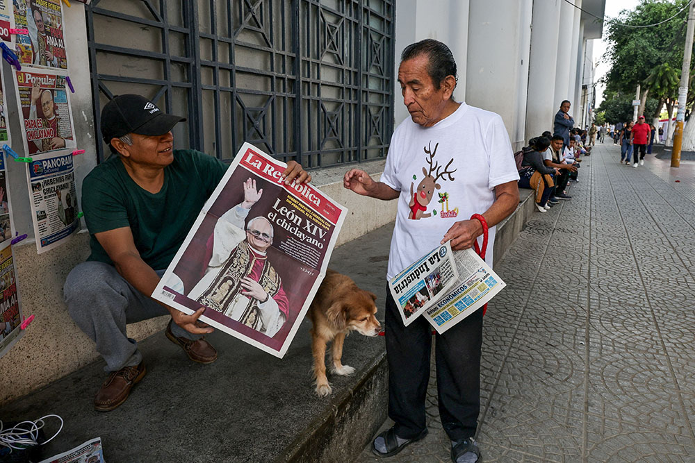 People hold newspapers in Chiclayo, Peru, May 9, 2025, reporting on the election of Pope Leo XIV, who is a dual U.S.-Peruvian citizen. (OSV News/Reuters/Sebastian Castaneda)
