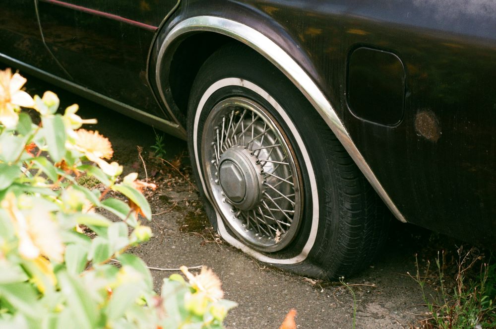 car with flat tire car with flat tire