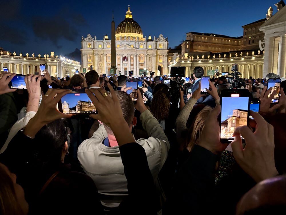 The crowd at St. Peter's Square takes photos of the black smoke from the Sistine Chapel on May 7. (NCR photo/James V. Grimaldi) The crowd at St. Peter's Square takes photos of the black smoke from the Sistine Chapel on May 7. (NCR photo/James V. Grimaldi)