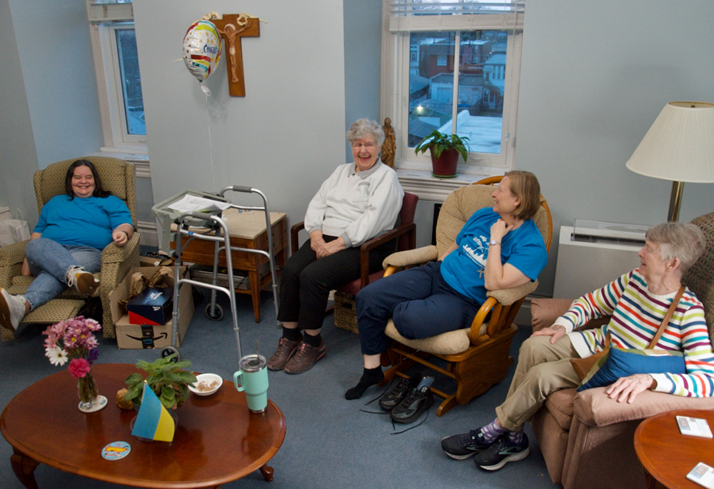 From left, Srs. Sandy Schmid, Emily Meehan, Kristina DeNeve and Pat Quinn relax in their small community's shared space in the motherhouse of the Sisters of St. Joseph of Carondelet in St. Louis. Not shown is Sr. Jo Ann Simanella. Schmid, DeNeve and Quinn are St. Joseph sisters; Meehan and Simanella are members of the Congregation of Divine Providence. (GSR photo/Dan Stockman)