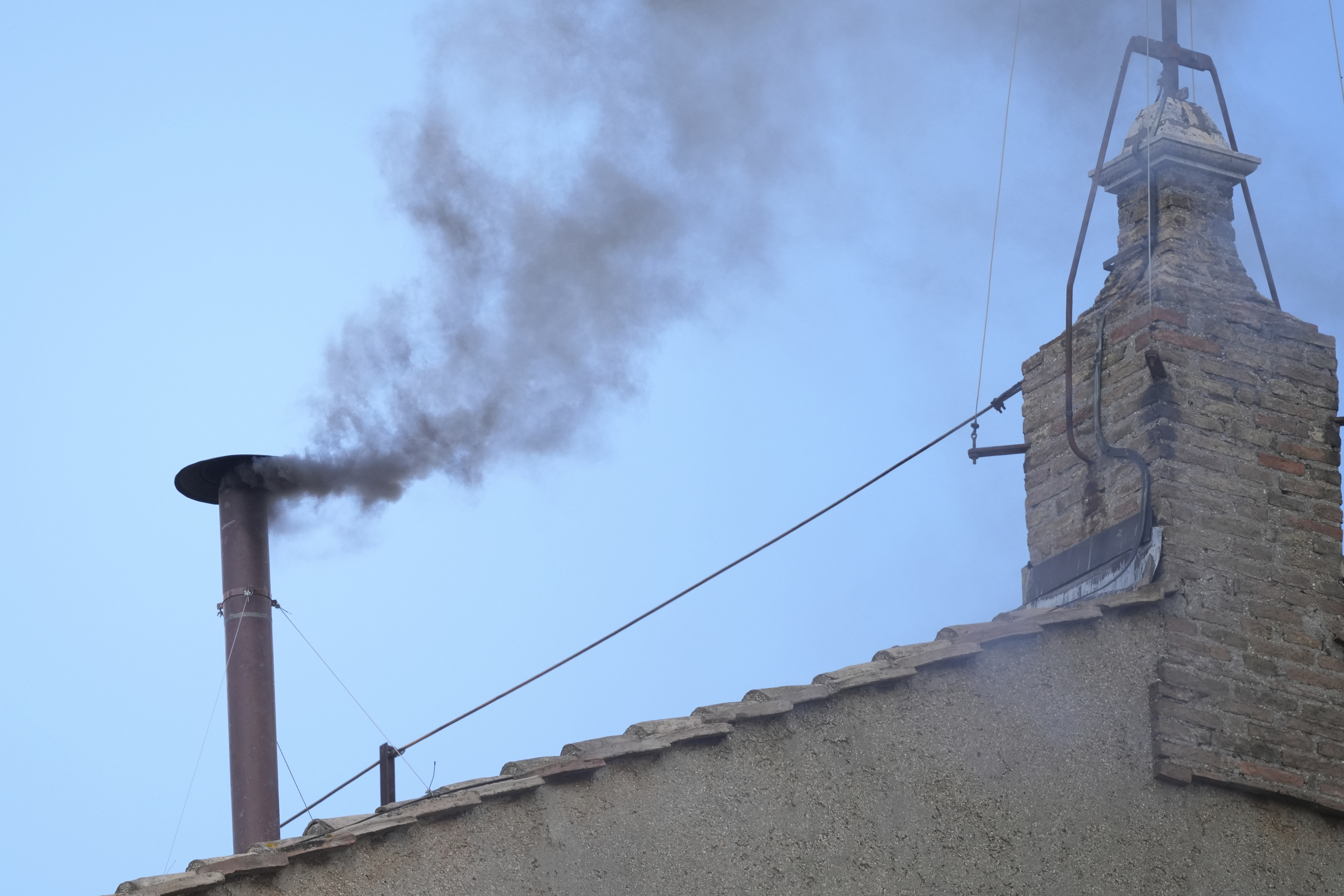 Black smoke billows from the chimney of the Sistine Chapel during the conclave to elect a new pope, at the Vatican, Thursday, May 8, 2025. (AP Photo/Andrew Medichini) Black smoke billows from the chimney of the Sistine Chapel during the conclave to elect a new pope, at the Vatican, Thursday, May 8, 2025. (AP Photo/Andrew Medichini)
