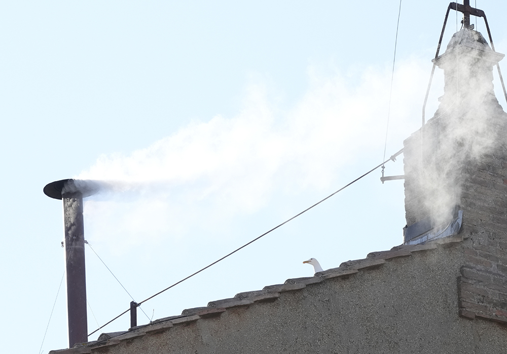 White smoke billows from the chimney of the Sistine Chapel during the conclave to elect a new pope, at the Vatican, on May 8, 2025. (AP photo/Andrew Medichini)