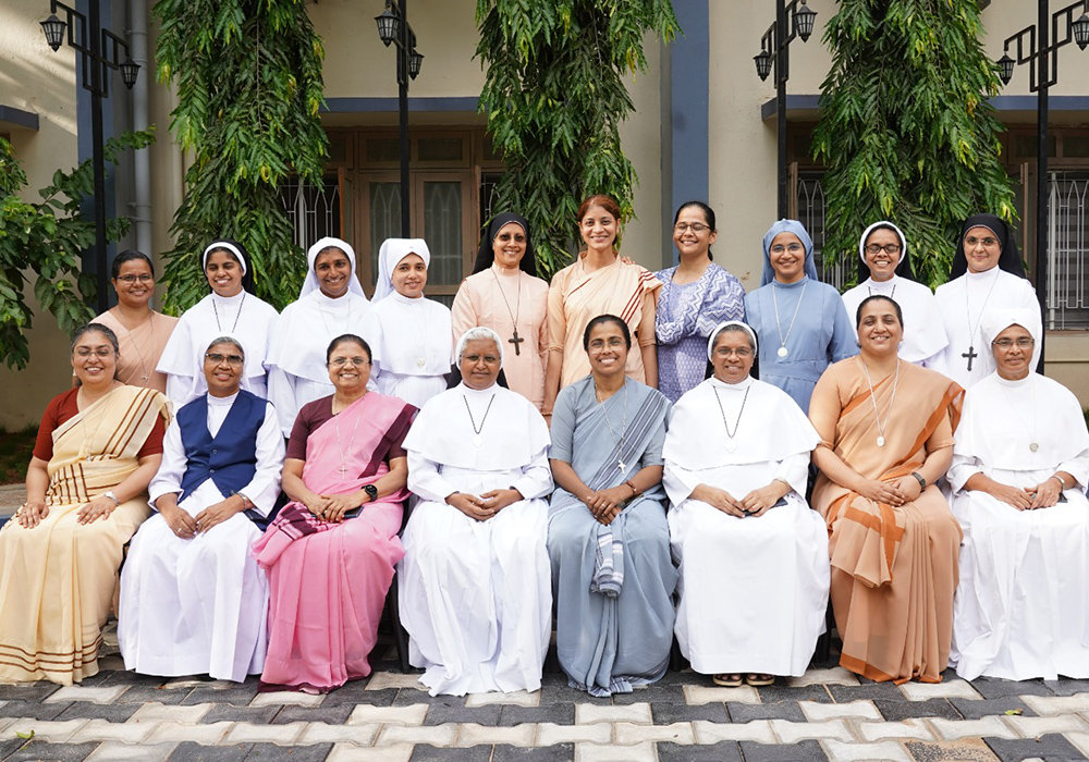 Twenty key members of sister-led mental health network Treasure are pictured at the Catholic Hospital Association of India's headquarters May 5-7 in Secunderabad, southern India. Sr. Sally John, its founder, is fourth from the right, sitting. (Courtesy of Sally John)