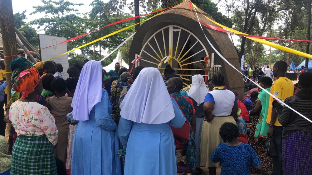Catholic sisters and other pilgrims face the shrine of St. Charles Lwanga at Namugongo. Catholic sisters and other pilgrims face the shrine of St. Charles Lwanga at Namugongo.
