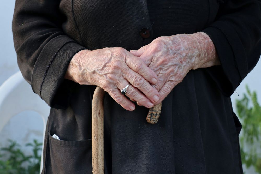 hands hold cane hands hold cane