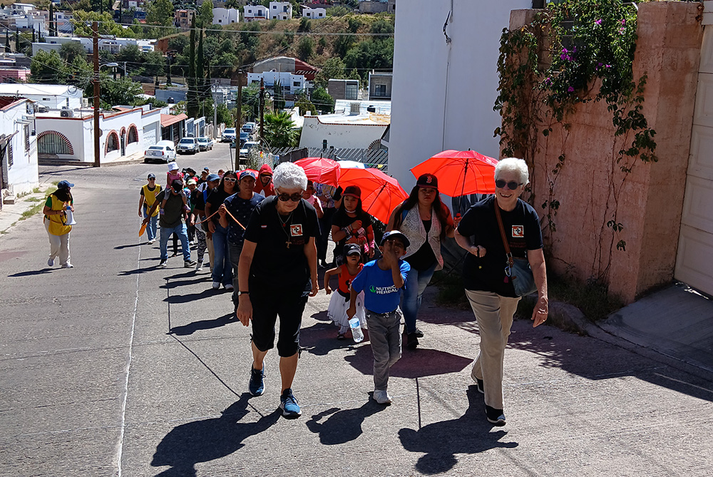 Sr. Diana De Bruin, a Sister of St. Francis of Assisi, Milwaukee, and Dominican Sr. Gemma Doll led a migrant procession through Nogales, Sonora, Mexico, in celebration of World Day of Migrants and Refugees on Sept. 29, 2024. (Courtesy of Kino Border Initiative)