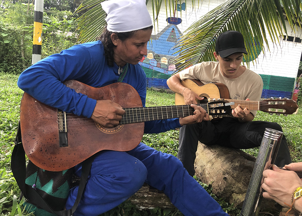 Bladimir Arteaga, or Blacho as he is fondly known, is pictured with Alén Inti Madaune, a video producer and GSR collaborator who is also a musician, on March 25, 2025, at the Peace Community of San José de Apartadó, Colombia. (Tracy L. Barnett)