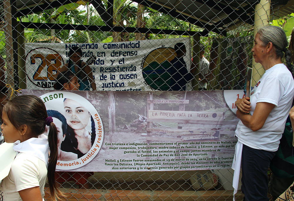 Sr. Mariela Beltrán is pictured on March 23, 2025, at the grave of Nallely Sepúlveda during the memorial service for Sepúlveda and Édinson David, two community members killed in 2024 in La Esperanza. Peace Community members and supporters traveled to La Esperanza to commemorate the anniversary of their deaths. (Tracy L. Barnett)