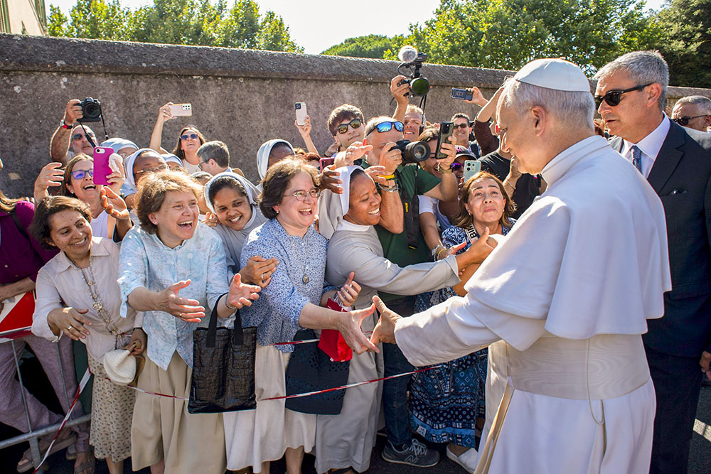 Pope Leo XIV greets people as he arrives in Castel Gandolfo, Italy, July 6, 2025, after reciting the Angelus at the Vatican. (CNS/Vatican Media)