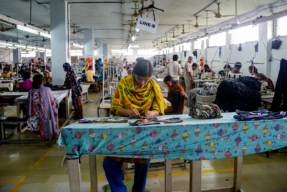 A 2011 photo shows garment factory workers on an assembly line in Bangladesh. (Wikimedia Commons/Tareq Salahuddin)