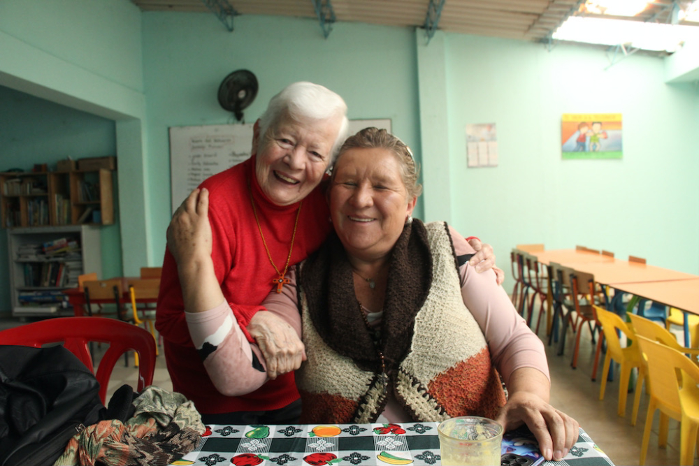 Sr. Maritze embraces Cecilia Arenas of the Mothers of Soacha, a longtime friend she calls "una gran luchadora" (a great fighter). 