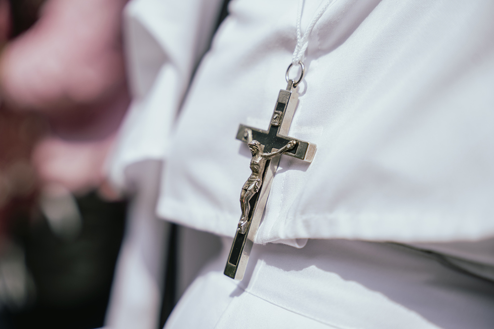 An unidentified nun wears a crucifix and her habit at a Good Friday procession on March 29, 2024, in Guwahati, Assam, India. (Dreamstime/Talukdardavid)