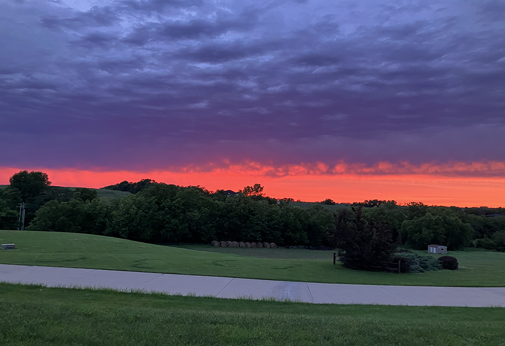 The sun sets over the Benedictine Monastery in Clyde, Missouri, in August 2025. (Helen Mueting)