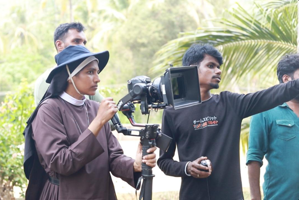 Sr. Lismy Parayil with her camera during a film shoot. (Courtesy of Lismy Parayil) Sr. Lismy Parayil with her camera during a film shoot. (Courtesy of Lismy Parayil)