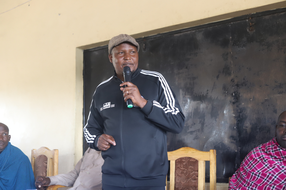 Emmanuel Lekishon Shangai, the legislator representing Ngorongoro, addresses Maasai residents raising concerns about government plans to remove them from ancestral land for tourism and wildlife protection. (GSR photo/Doreen Ajiambo) Emmanuel Lekishon Shangai, the legislator representing Ngorongoro, addresses Maasai residents raising concerns about government plans to remove them from ancestral land for tourism and wildlife protection. (GSR photo/Doreen Ajiambo)