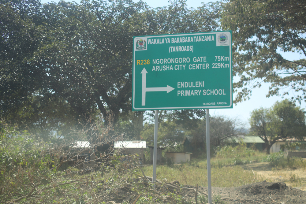 A sign stands near Endulen Primary School in Tanzania's Ngorongoro Conservation Area. The government has demolished schools, homes and health facilities while pressing Maasai families to leave their ancestral land in the name of wildlife protection and tourism. (GSR photo/Doreen Ajiambo) A sign stands near Endulen Primary School in Tanzania's Ngorongoro Conservation Area. The government has demolished schools, homes and health facilities while pressing Maasai families to leave their ancestral land in the name of wildlife protection and tourism. (GSR photo/Doreen Ajiambo)