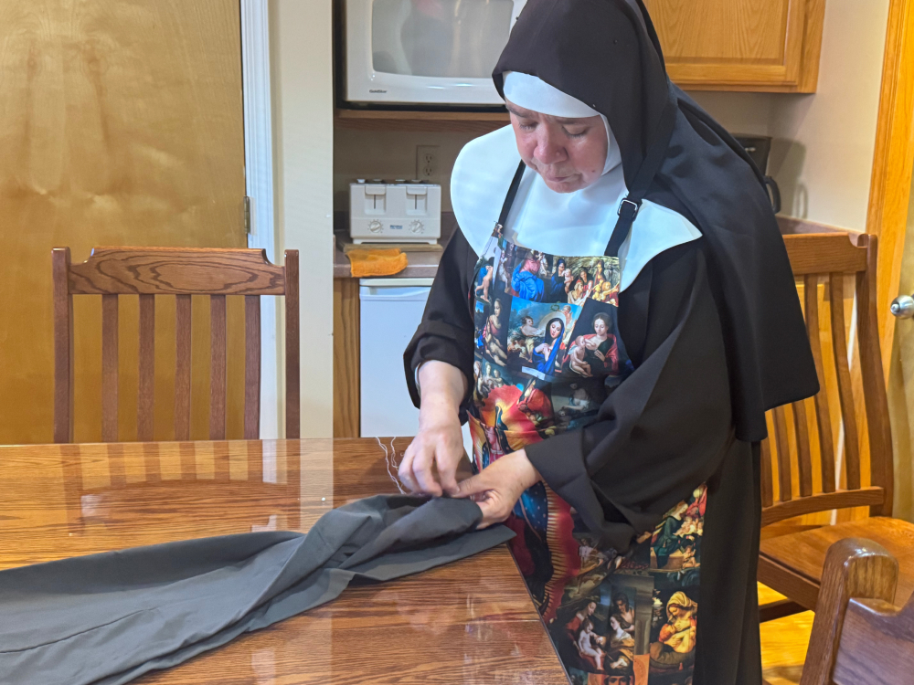 Capuchin Poor Clare Sr. Maria Elena Romero sews Oct. 4, 2025 at the Veronica Giuliani Monastery in Wilmington, Delaware. Capuchin Poor Clare Sr. Maria Elena Romero sews Oct. 4, 2025 at the Veronica Giuliani Monastery in Wilmington, Delaware.