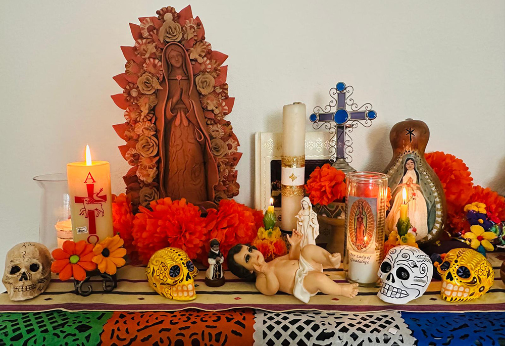 Detail of the altar created by Elia Cárdenas, featuring candles, flowers, and symbols of gratitude for the lives of Dominican Sisters (Courtesy of Elia Cárdenas)