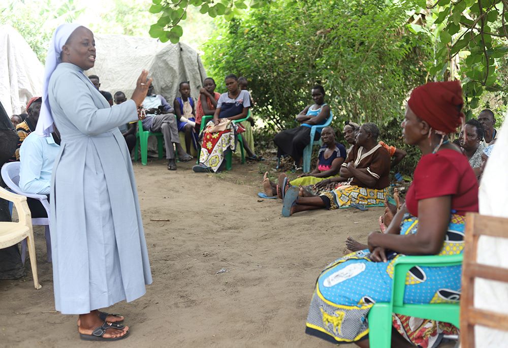 Sr. Celestine Nelima addresses flood victims at the Khumwanda displacement camp in Busia County. 