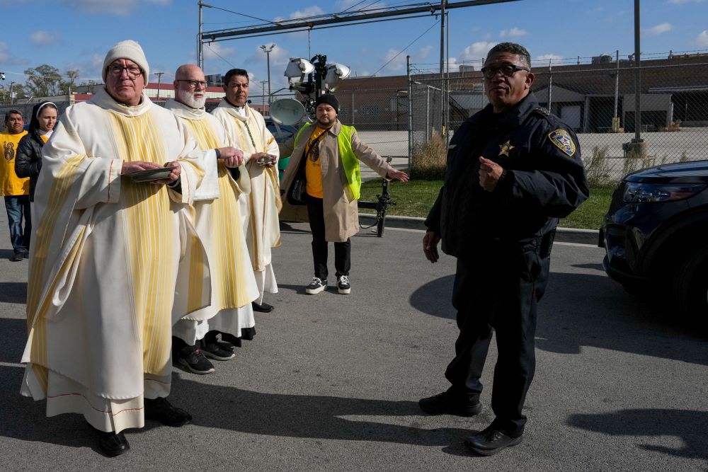 Law enforcement officers prevent clergy from entering the Broadview ICE facility and offering Communion to immigrants detained inside.
