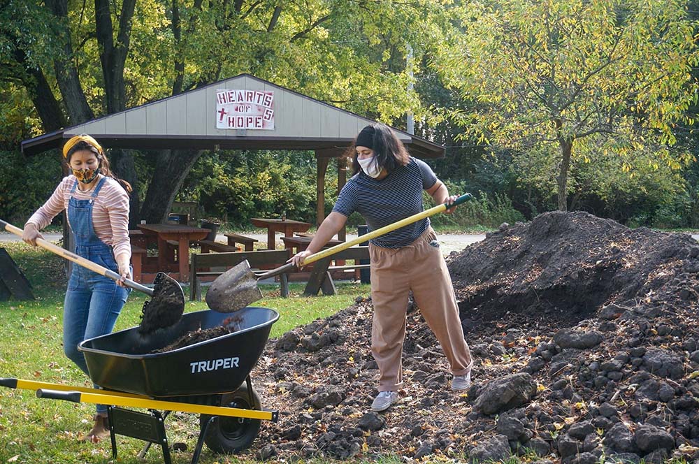 People work on a garden at Sacred Heart Parish Mission in the Diocese of Joliet, Ill. The food grown is distributed to people in need of food assistance in the community. (CNS/Courtesy of Joliet Diocese)